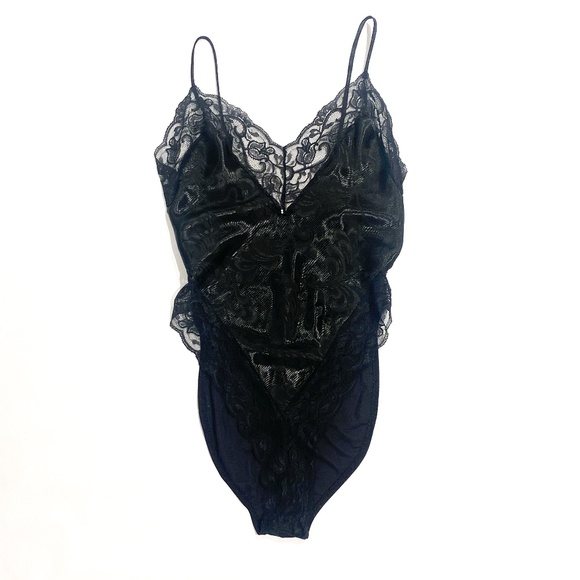 Vintage Lingerie. Black with lace trim and floral print on fabric.